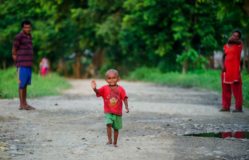 Private Tours, little boy waving in Nepal