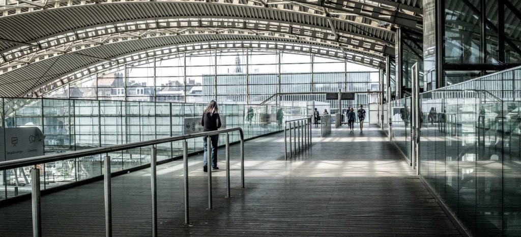 how to travel alone safely - woman alone in an airport